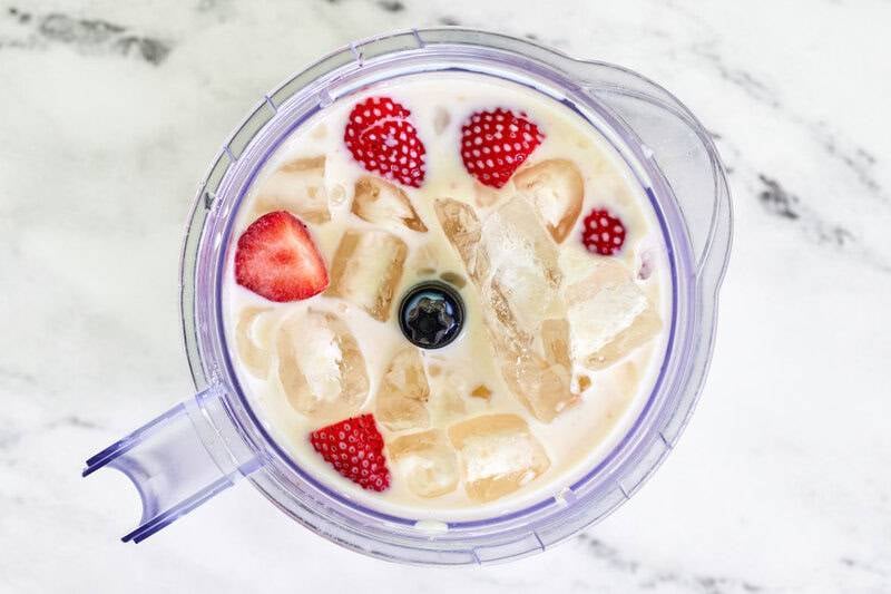Copycat strawberry julius ingredients in a blender.