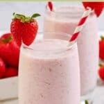 Homemade strawberry julius garnished with a fresh strawberry.