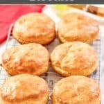 Six homemade Bojangles buttermilk biscuits on a wire rack.