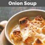 Homemade Brown Derby French onion soup in a stone crock.