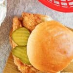 Homemade Chick-fil-A chicken sandwich on a wood board.