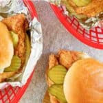 Three homemade Chick-fil-A chicken sandwiches.