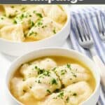 Homemade cracker barrel dumplings in bowls and forks next to them.