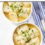 Homemade cracker barrel dumplings in two small bowls.