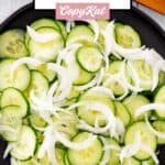 Cucumber onion salad in a serving bowl.