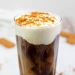 Homemade Dunkin Donuts cookie butter cold brew coffee drink and cookies next to it.