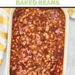 Homemade Durgin Park Boston baked beans in a casserole dish on a marble surface.