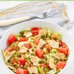Homemade green jacket salad in a bowl and a fork next to it.