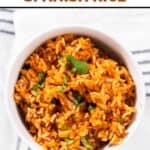 A bowl of homemade Guadalajara Spanish rice on a kitchen towel.