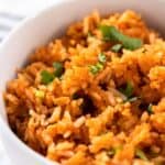 A bowl of homemade Guadalajara Spanish rice garnished with cilantro.