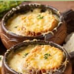Two ceramic bowls of classic homemade French onion soup.