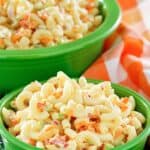 Homemade macaroni salad in a small and large serving bowl.
