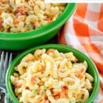 Two bowls of homemade classic macaroni salad.