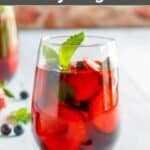 Homemade Olive Garden berry sangria garnished with fresh mint.