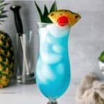 Homemade Olive Garden Blue Hawaiian drink in a hurricane glass.