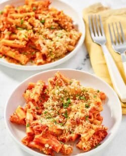 Copycat Olive Garden five cheese ziti al forno on two plates.