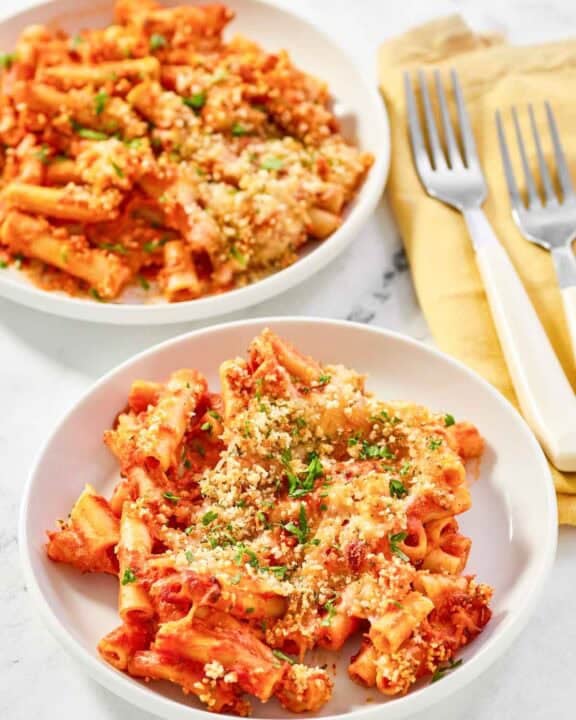 Copycat Olive Garden five cheese ziti al forno on two plates.