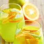 Two glasses of copycat Olive Garden green apple moscato sangria.