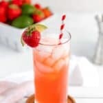 Homemade Olive Garden Italian rum punch cocktail in a tall glass on a coaster.