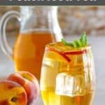 Homemade Olive Garden peach iced tea in a wine glass and pitcher.