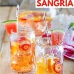 Copycat Olive Garden watermelon sangria in two glasses and a pitcher.