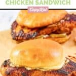 Homemade Popeyes blackened chicken sandwiches with mayo and pickles.