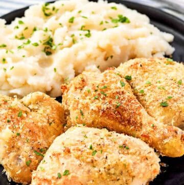 Crispy potato flake chicken and mashed potatoes on a plate.