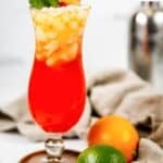 Homemade Red Lobster mai tai, a lime, and an orange.