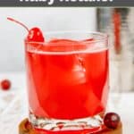 Homemade Ruby Tuesday ruby relaxer cocktail and cherries beside it.