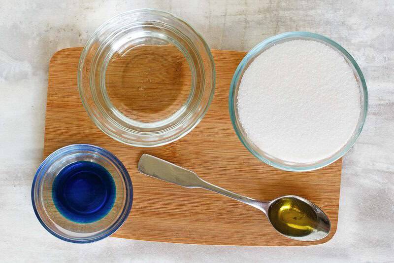Ingredients for Sonic ocean water drink on a small wood board.
