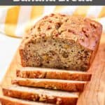 Homemade Starbucks banana walnut and pecan bread loaf on a wood board.