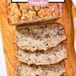 Homemade Starbucks banana walnut and pecan loaf on a wood board.