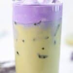 A glass of copycat Starbucks iced lavender cream oatmilk matcha and fresh lavender.