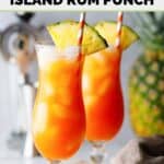 Homemade TGI Friday's Captain Morgan island rum punch in two glasses on a wood board.
