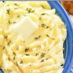 Homemade yukon gold mashed potatoes garnished with fresh thyme and butter.