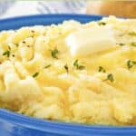 Homemade yukon gold mashed potatoes topped with a pat of butter.