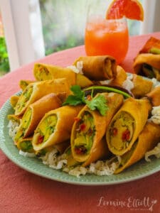 Copycat Cheesecake Factory avocado egg rolls on a platter.
