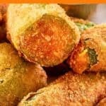 Fried jalapeno poppers with cheddar cheese on a plate.