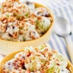 Two bowls of homemade chicken salad chick grape salad.