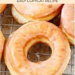 Homemade Krispy Kreme glazed donuts on a wire rack.