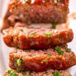 Mamma Joe's meatloaf on a platter and three slices cut from it.