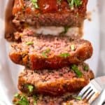 Slices of Mamma Joe's meatloaf and a piece on a fork.