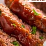 Slices of Mamma Joe's meatloaf on a plate.