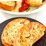 Two slices of homemade Marie Callender's garlic toast on a small plate.