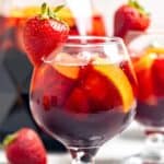Homemade Olive Garden sangria in glasses and a pitcher.
