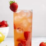 Copycat Red Robin freckled lemonade, strawberries, and lemon wedge.