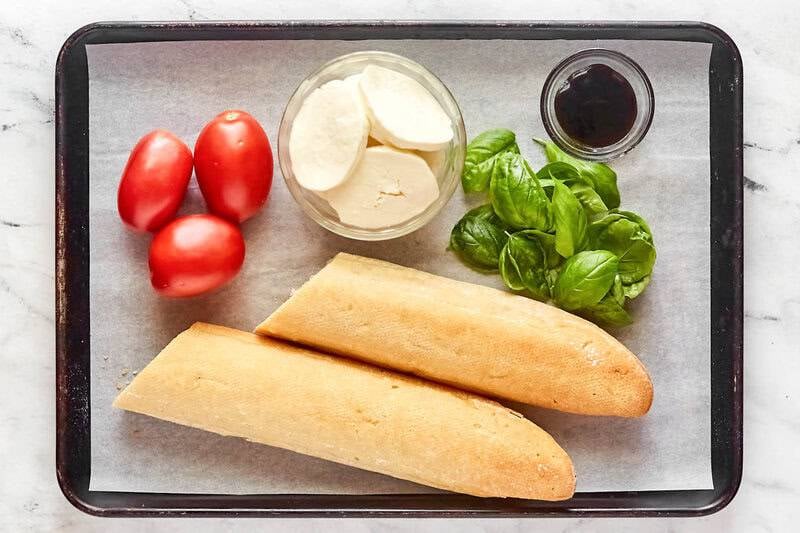 Copycat spaghetti warehouse caprese bruschetta ingredients on a tray.