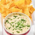 Copycat Applebee's queso blanco dip and tortilla chips on a platter.