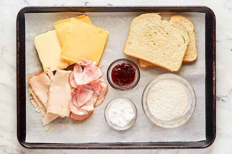 Copycat Cheddar's monte cristo sandwich ingredients on a tray.