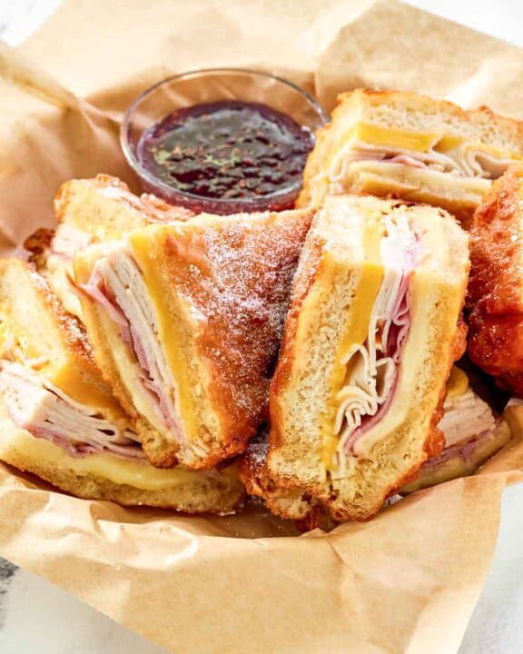 Copycat Cheddar's monte cristo sandwich served with raspberry jam.